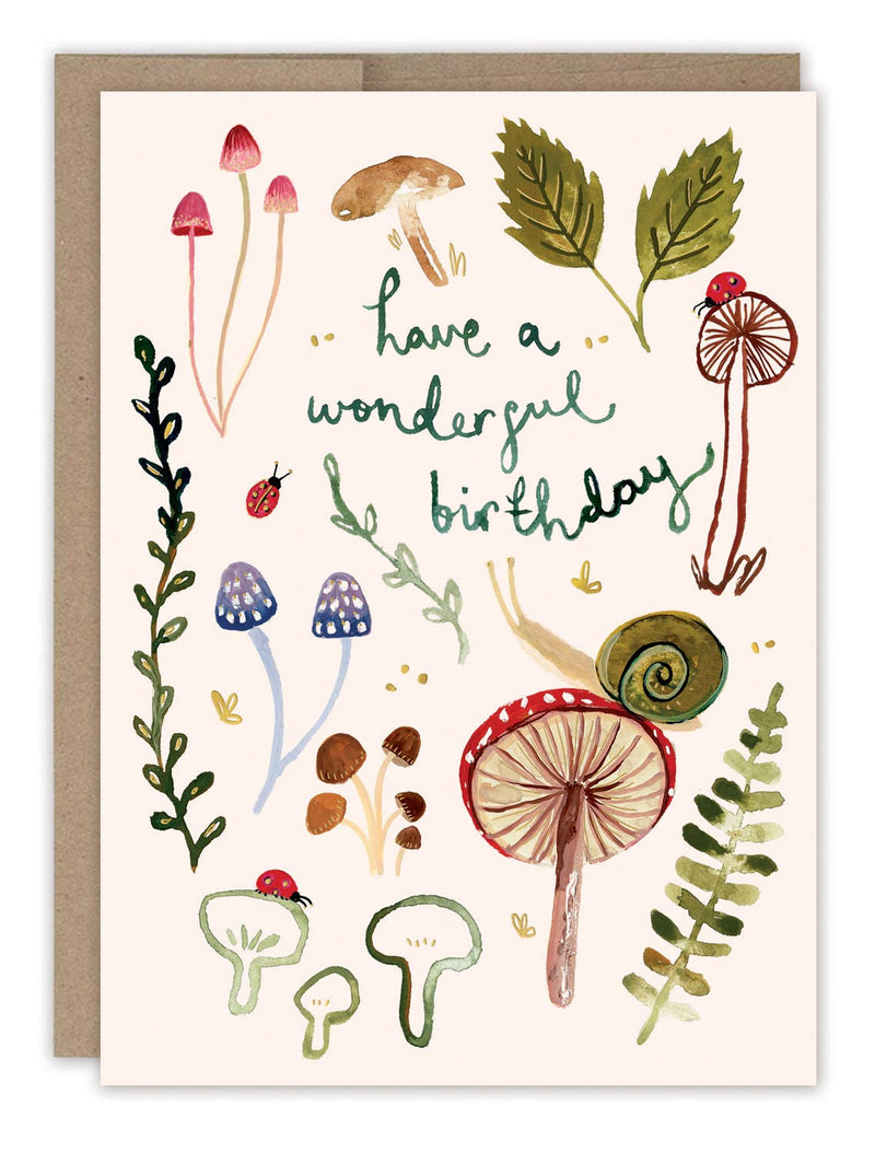 A white birthday card watercolor illustrated with mushrooms, leaves, snails, and ladybugs with the words "Have a wonderful birthday".