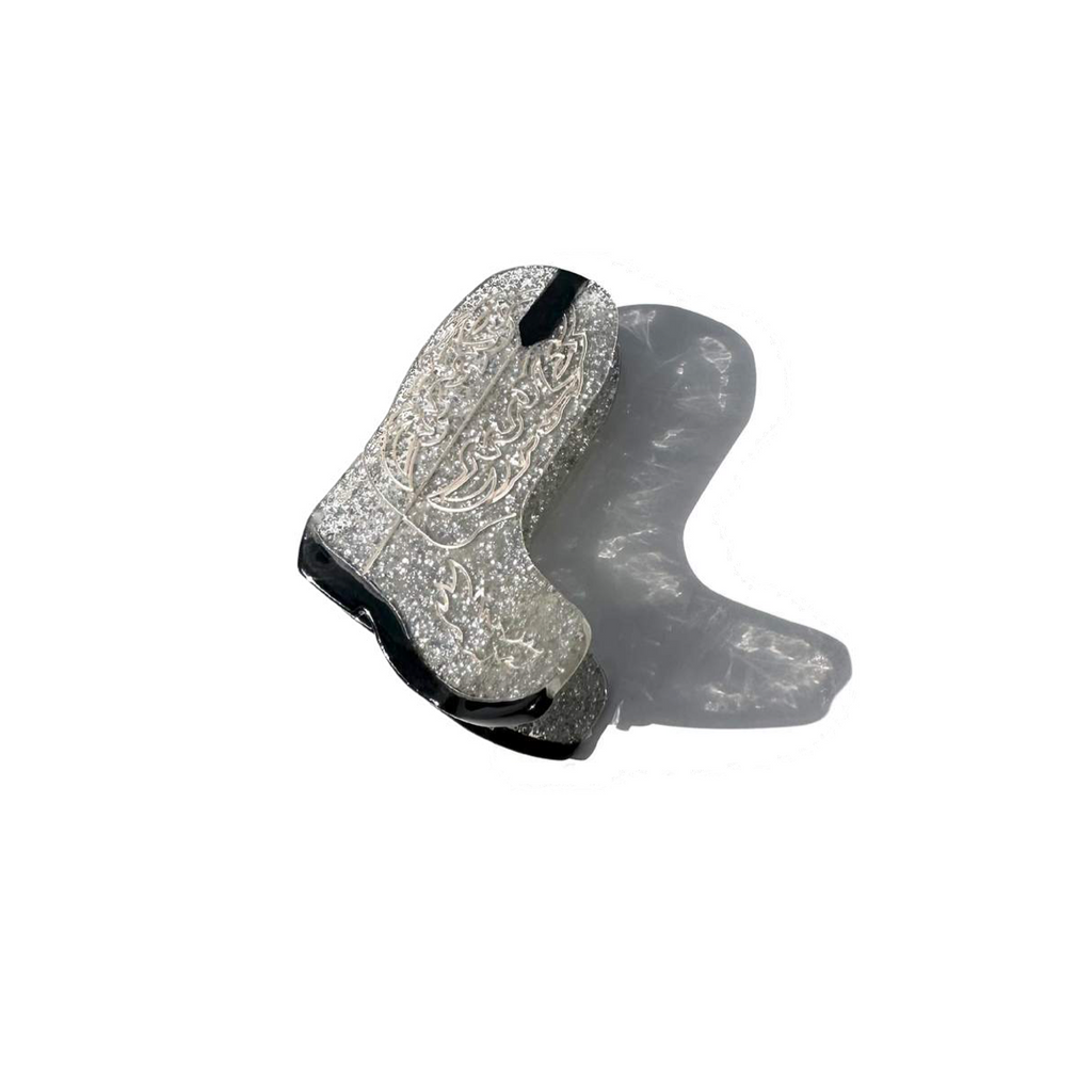 A silver glitter Cowboy Boot Claw Clip detailed with black and silver inlay paint.