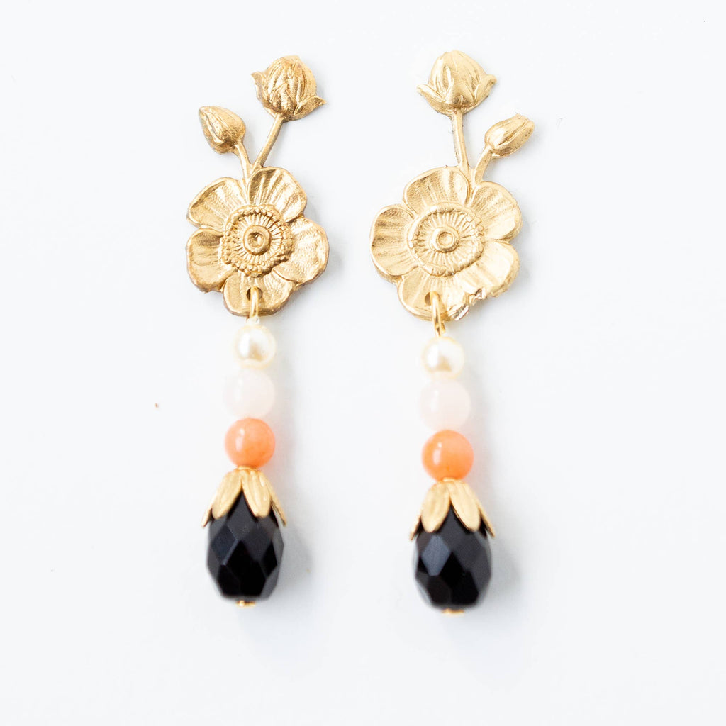 A pair of gold flower studs with a Swarovski glass pearl, Coral, and Rose Quartz stone hanging straight down.