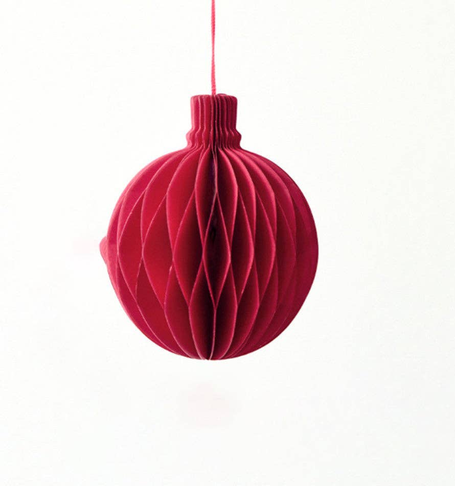 A red circular paper ornament.