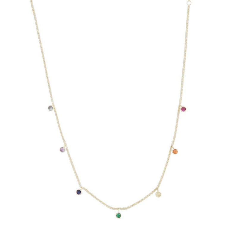 A gold chain necklace with pale blue, purple, dark blue, green, yellow, orange, and red crystals hanging along its length.