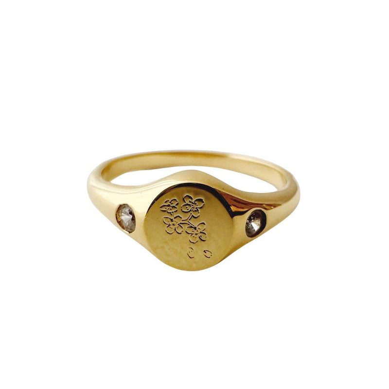 A close-up of the Flora Signet Ring in Gold.