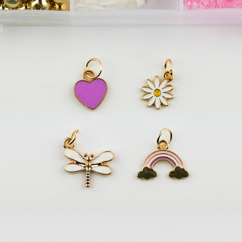 A purple heart charm, a daisy charm, a white dragonfly charm, and a rainbow harm with black clouds and pink stripes.