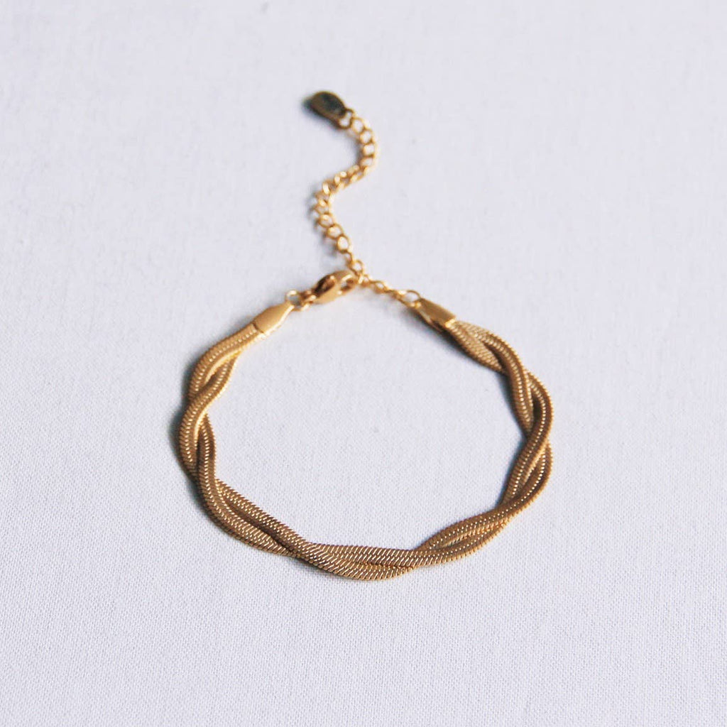 A Braided Snake Bracelet lying flat.