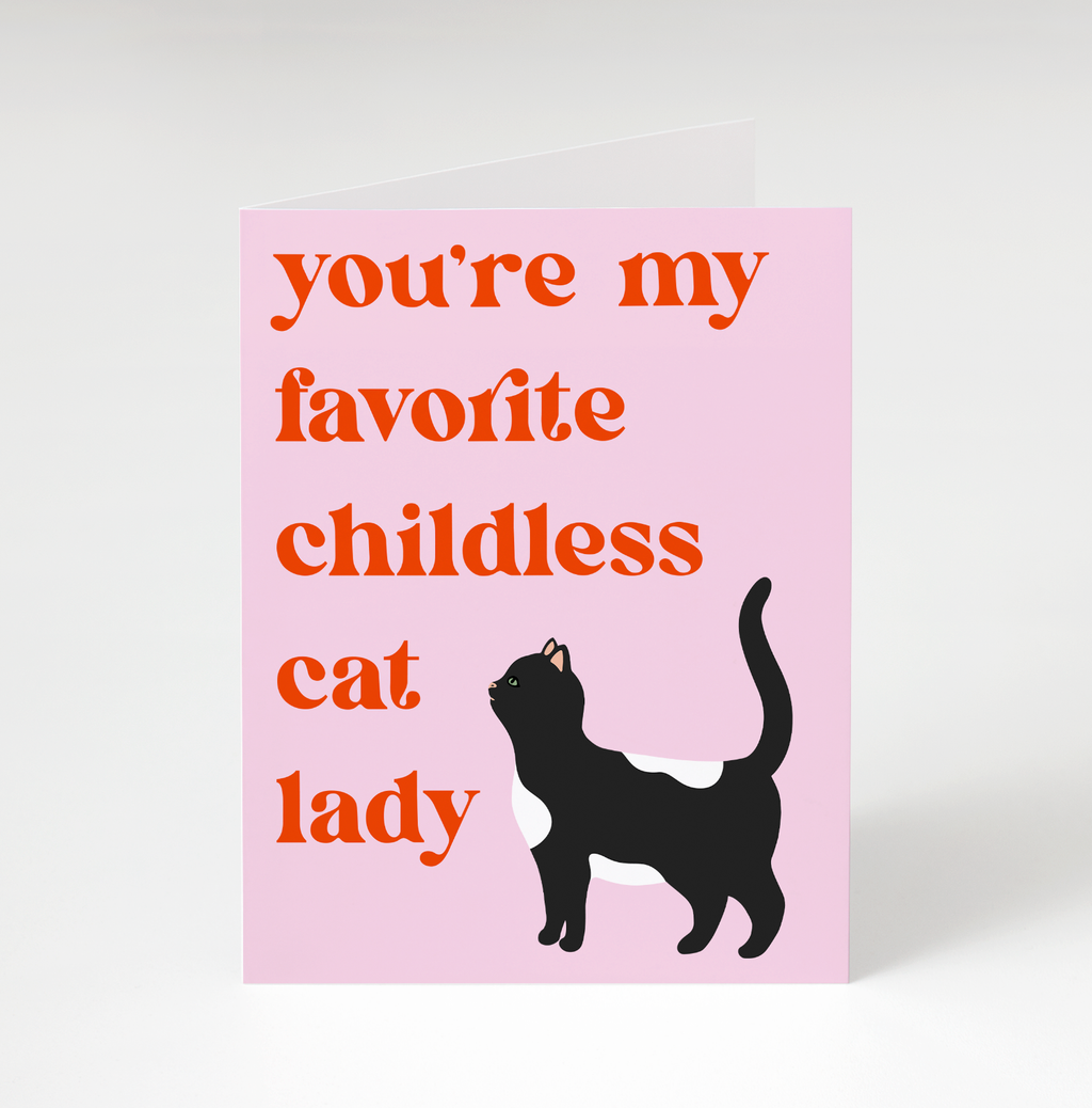 A pink card featuring an illustration of a tuxedo cat and the words "you're my favorite childless cat lady."