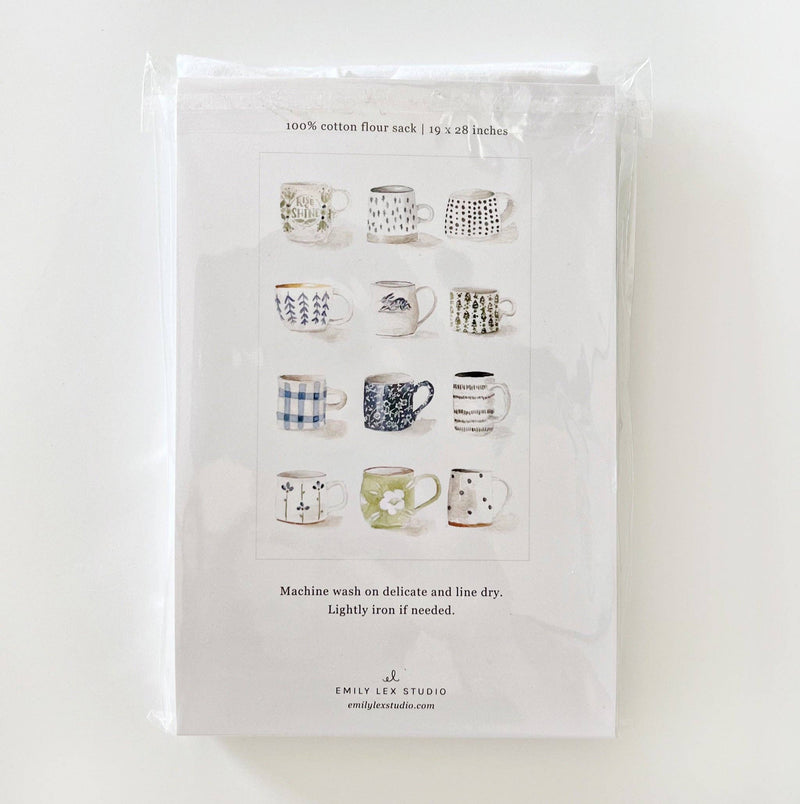 The back of the Mugs Tea Towel packaging showing what each mug looks like on the towel.