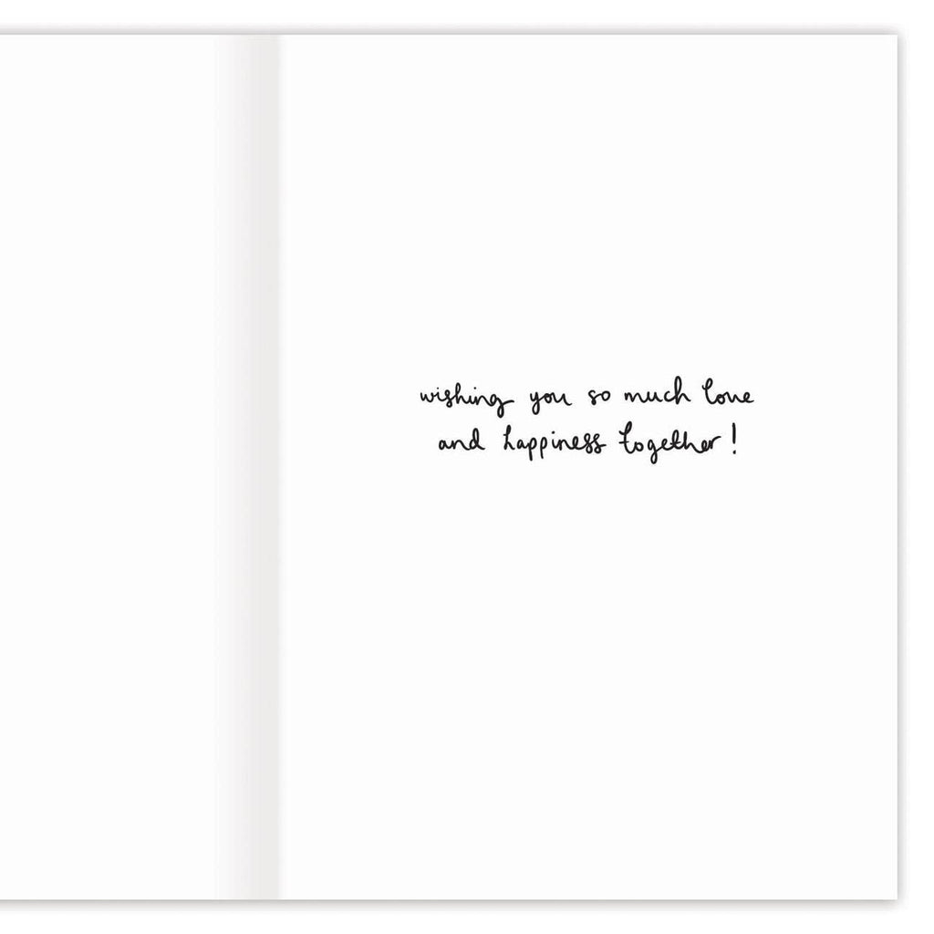 The white inside of the card that says "wishing you so much love and happiness together!" in black cursive.