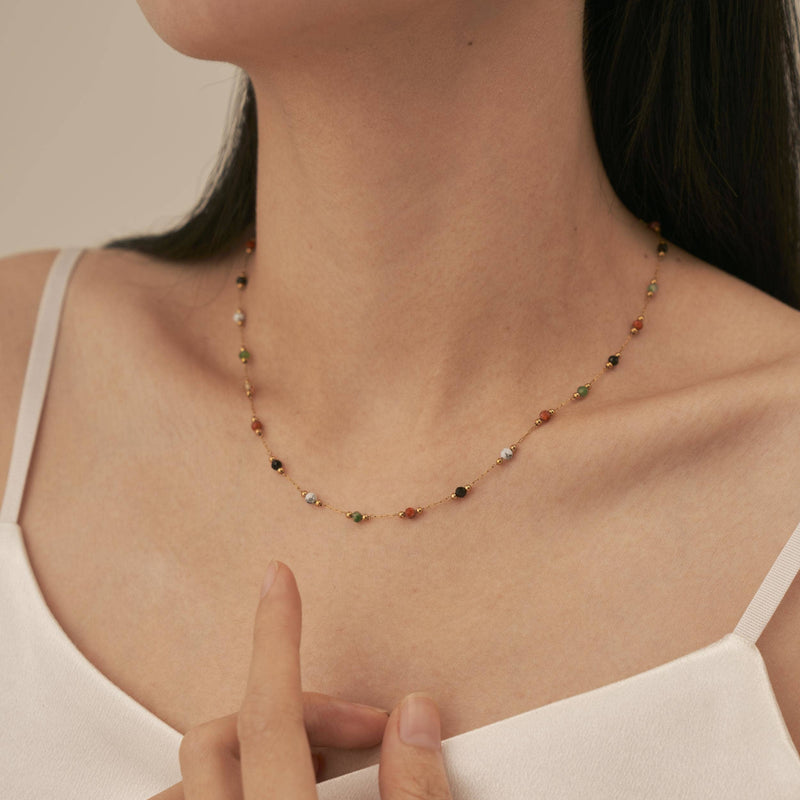 A person wearing the Warm Agate Beaded Necklace.