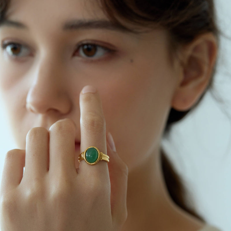 A person wearing the Aventurine Signet Ring.