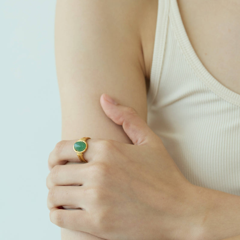 A person wearing the Aventurine Signet Ring.