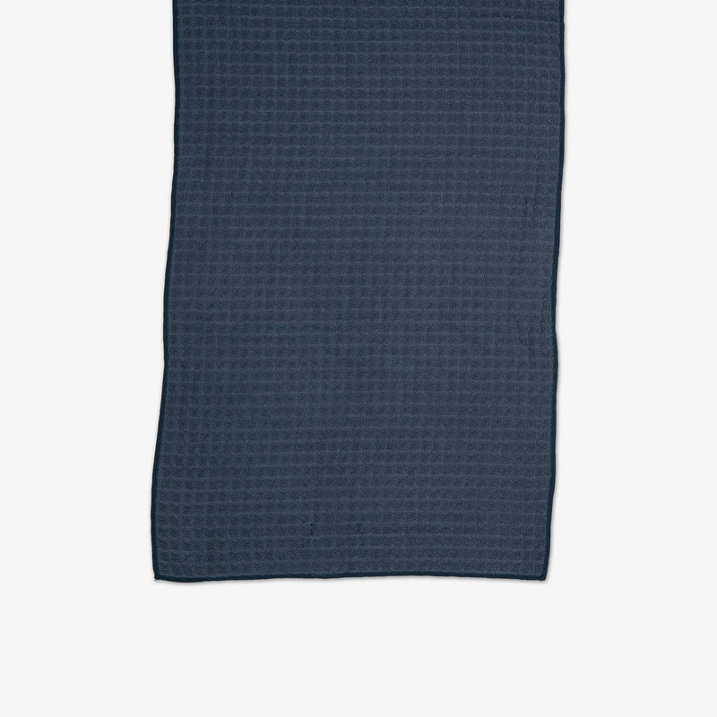 A Midnight Blue Waffle Hand Towel laid flat.