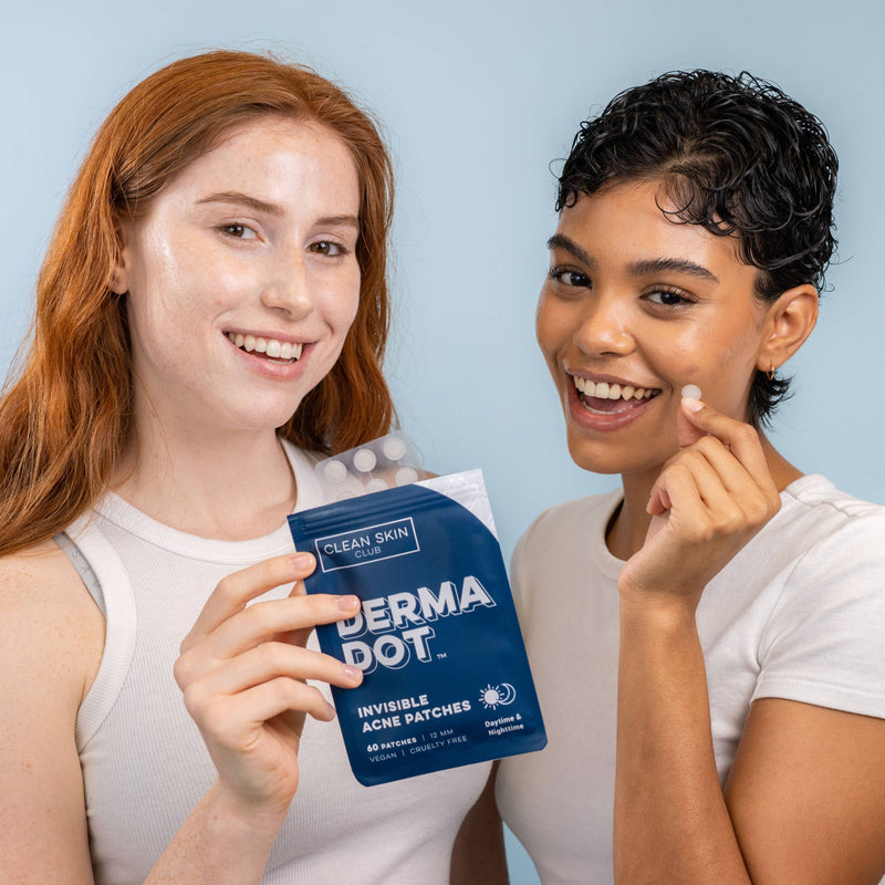 Two people using the Derma Dots and smiling.