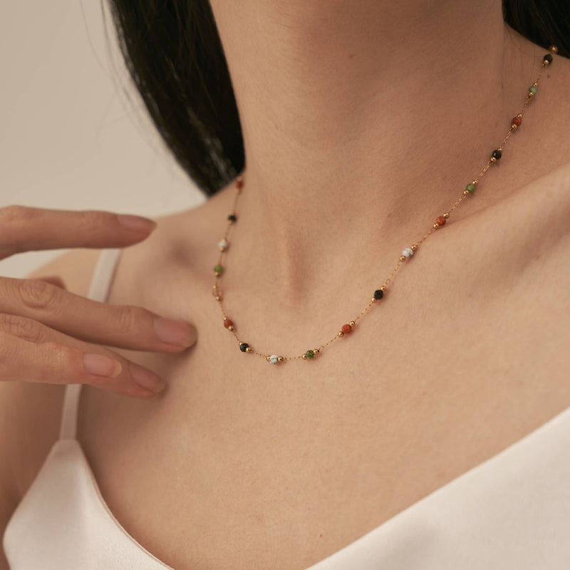 A person wearing the Warm Agate Beaded Necklace.