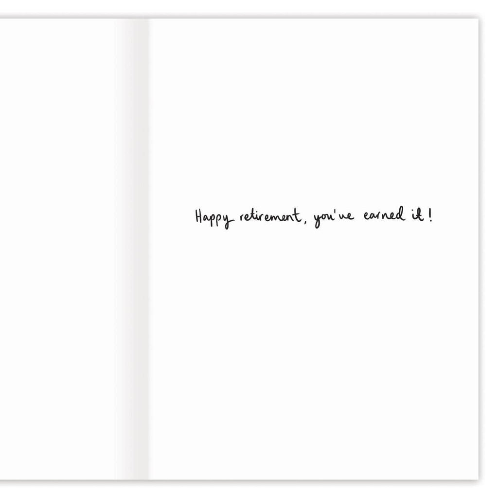 The inside of the card which readings "happy retirement, you've earned it!" in black cursive.