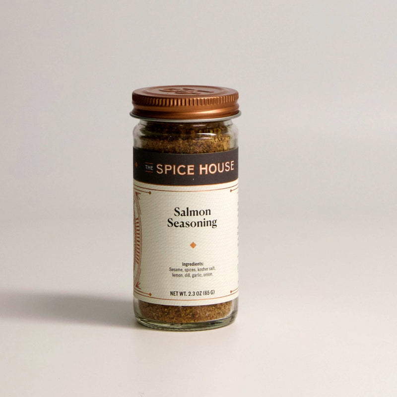 A clear glass jar of Spice House Salmon Seasoning with a copper lid.