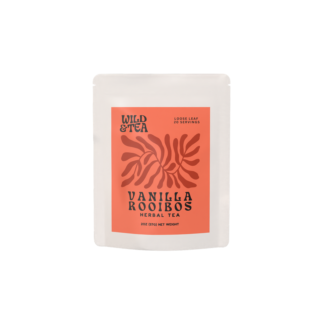 A white bag filled with Vanilla Rooibos herbal tea with an orange red label illustrated with an abstract plant.