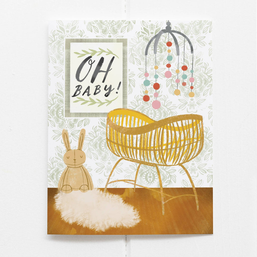 A card with an illustration of a baby's nursery with the words "Oh Baby!".