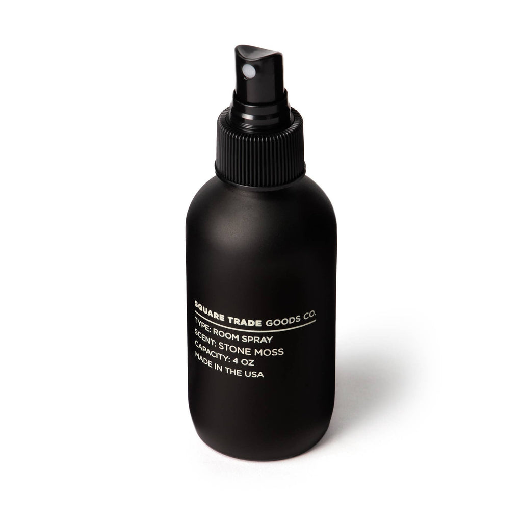 A matte black bottle of Stone Moss Room Spray.