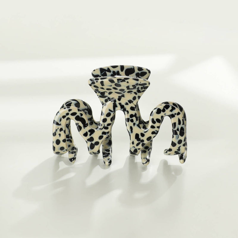 An Esme claw clip with a black on white speckled pattern.