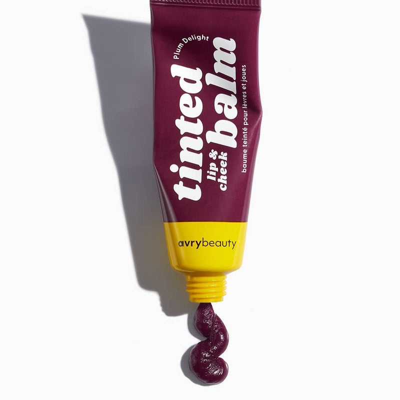 A tube of Plum Delight Lip & Cheek Tinted Balm with a squiggle of balm squeezed out the bottom.