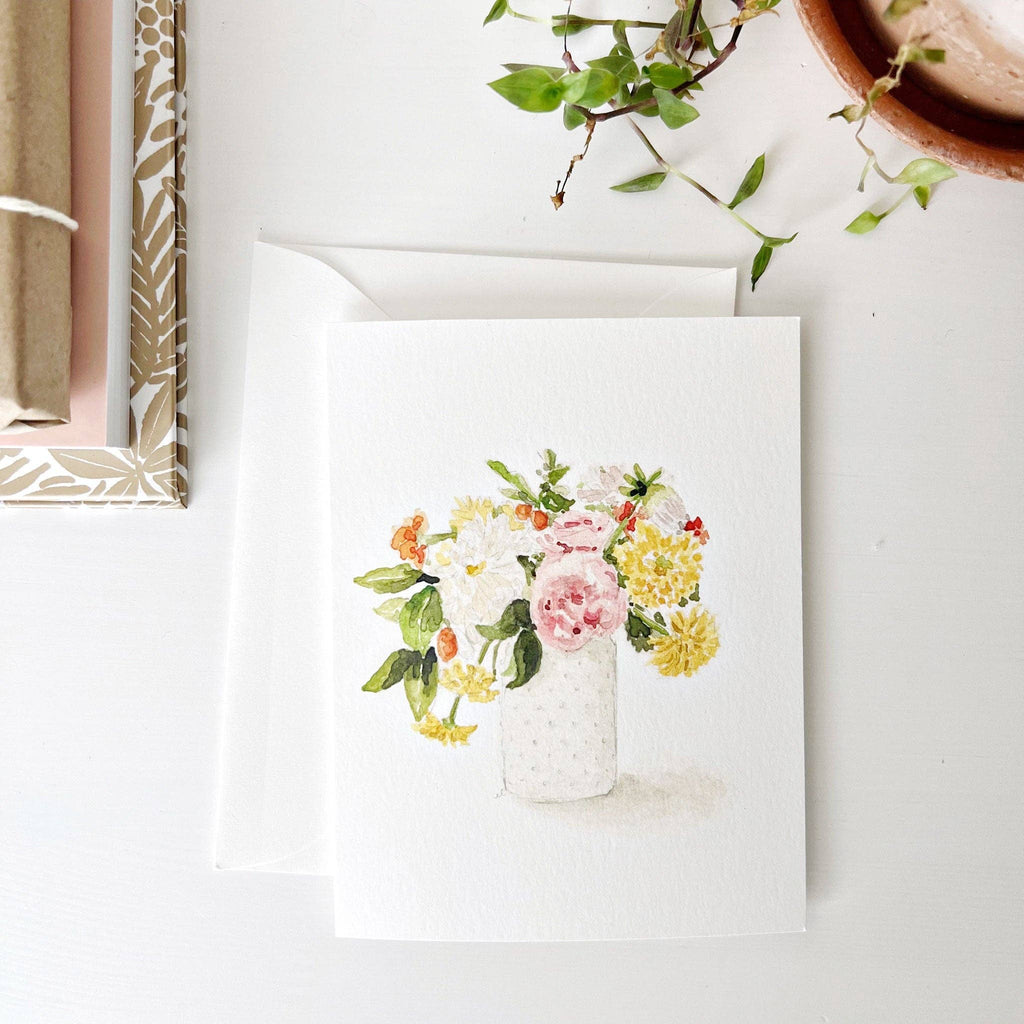 A Hobnail Bouquet Notecard resting on a desk