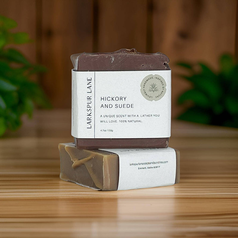 Two Hickory & Suede Soap bars stacked on one another.