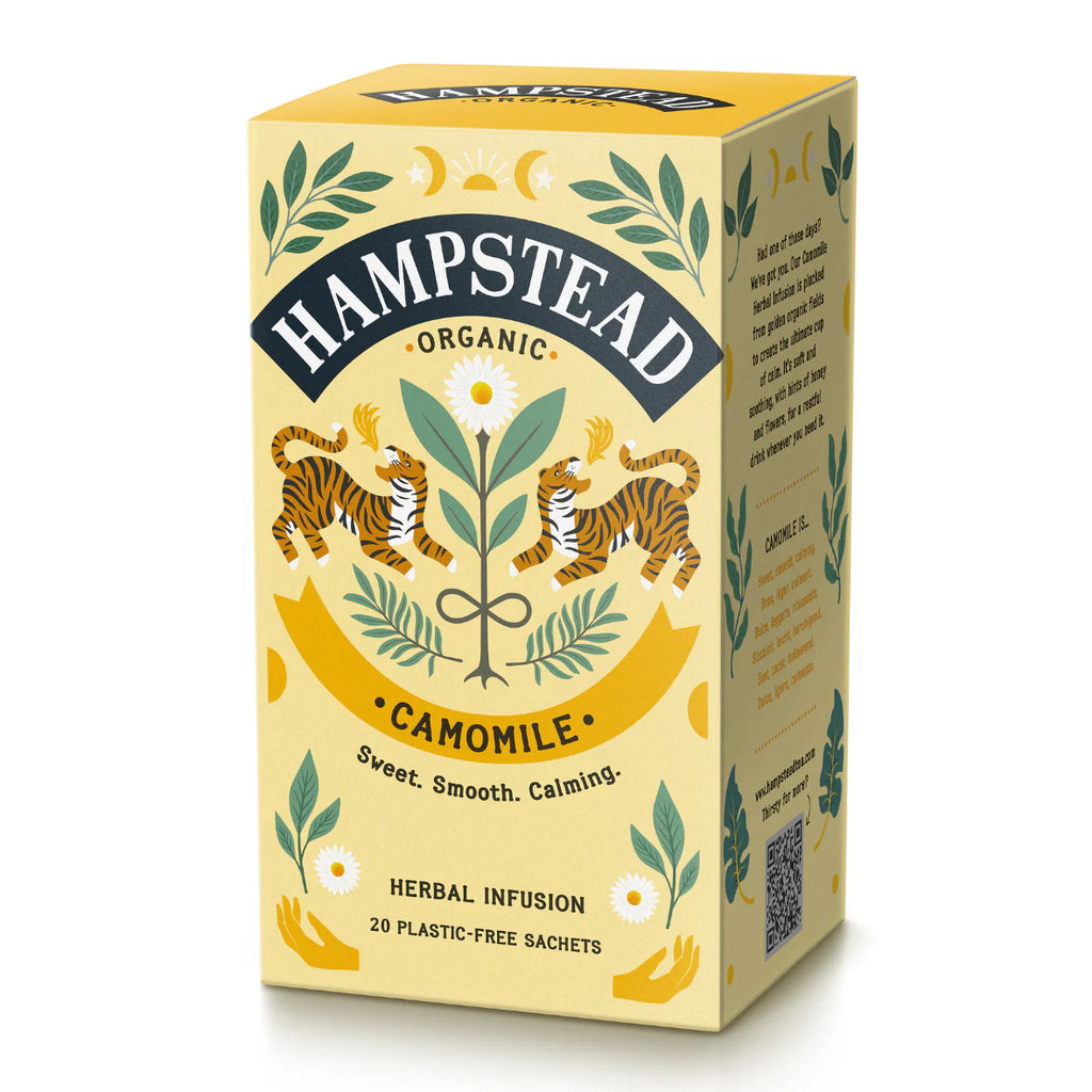 A yellow box of Hampstead Organic Camomile Tea with illustrations of two tigers, chamomile flowers, leaves, and lunar imagery.