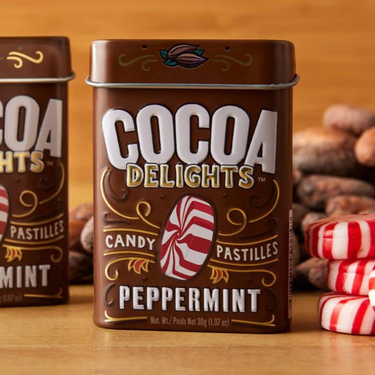 A brown tin of Peppermint Cocoa Delights candies.