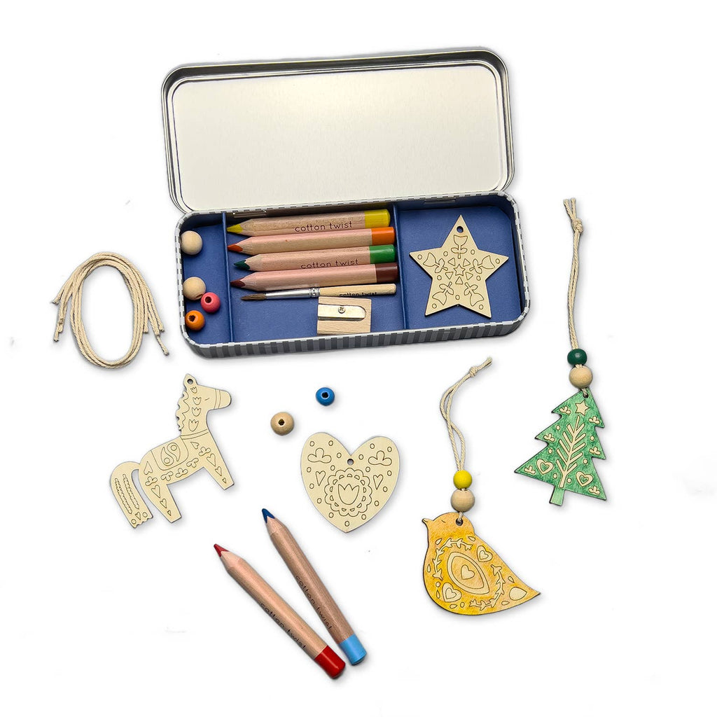 A kit with supplies and materials to make folk art inspired holiday decor.