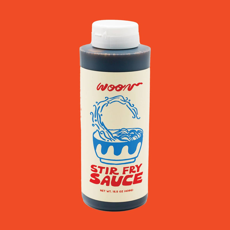 A bottle of Woon Stir Fry Sauce with an abstract illustration of a bowl of stirfry.