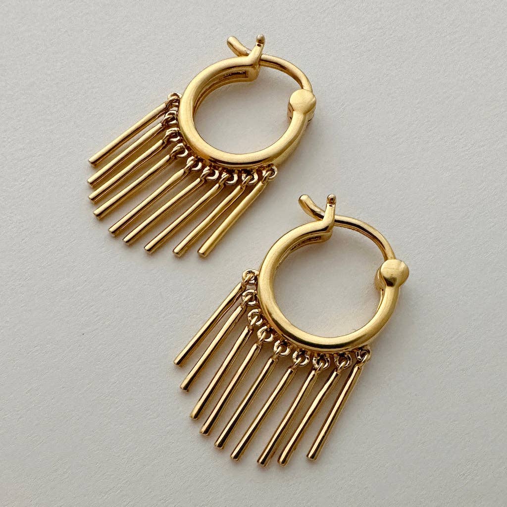 A pair of gold plated hoop earrings with nine bars hanging like a fringe along it.