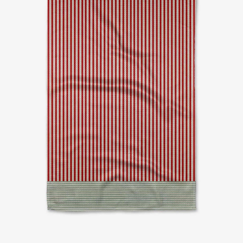 A white tea towel with red vertical stripes ending in green horizontal stripes.