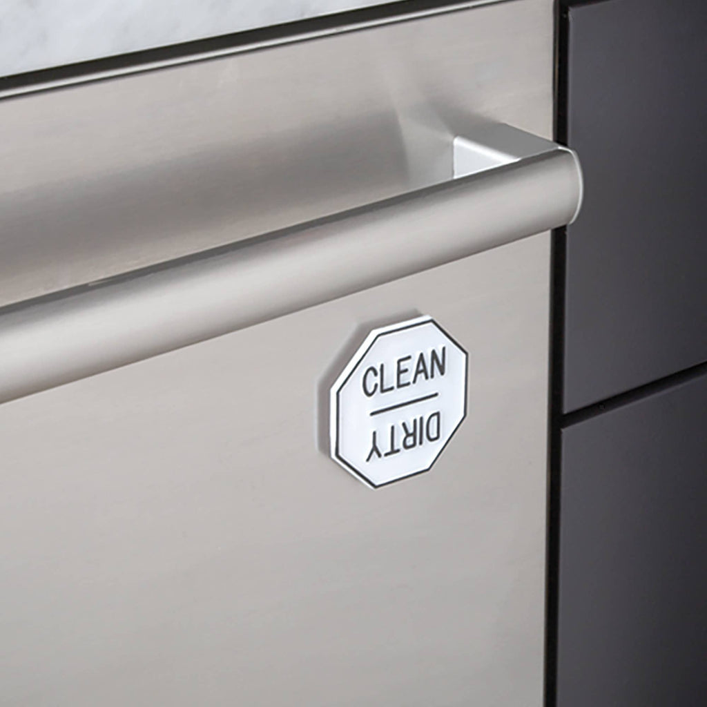 A magnet with the Clean side up on a dishwasher.