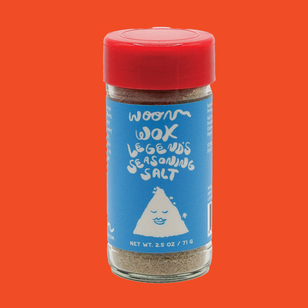 A clear glass jar of Woon Wok Legend's Seasoning Salt with a red cap.