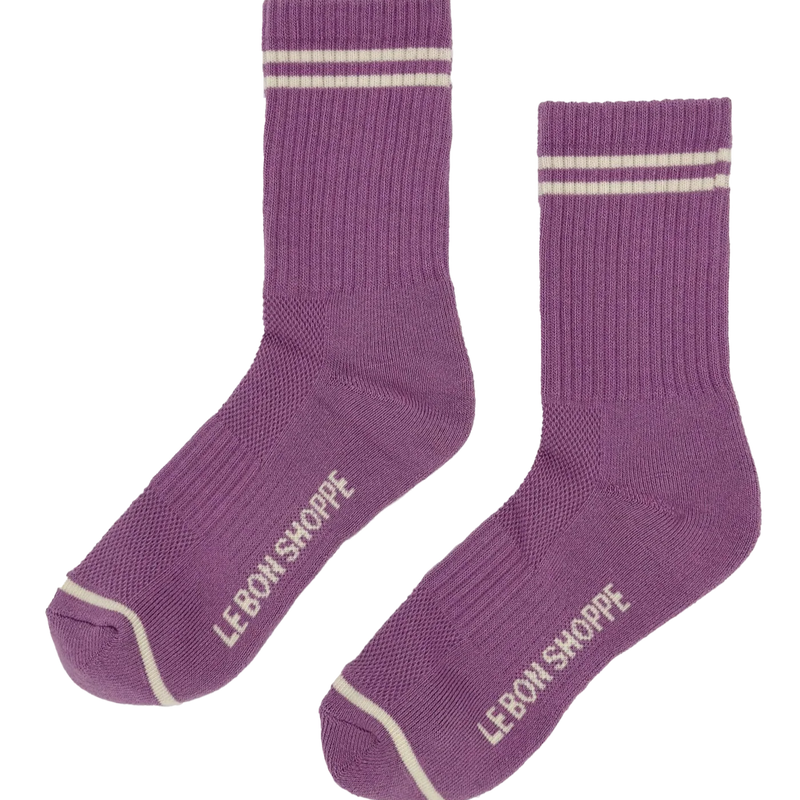 A pair of grape purple crew length socks with two white stripes at the ankle and one white stripe at the toe.