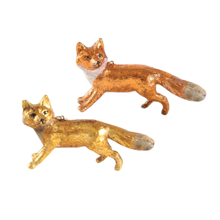 A copper fox ornament on top and a gold fox ornament below.