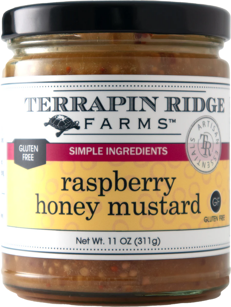 A clear jar of Raspberry Honey Mustard with a black lid.