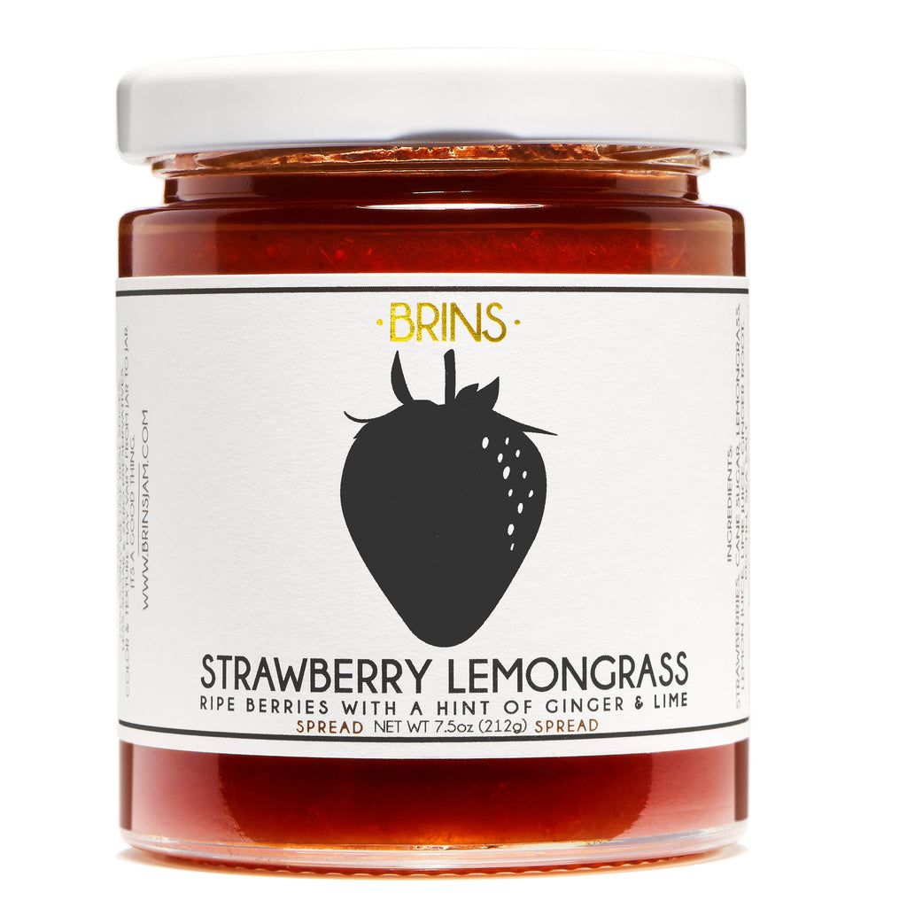 A clear glass jar of Strawberry Lemongrass Spread with a white cap.