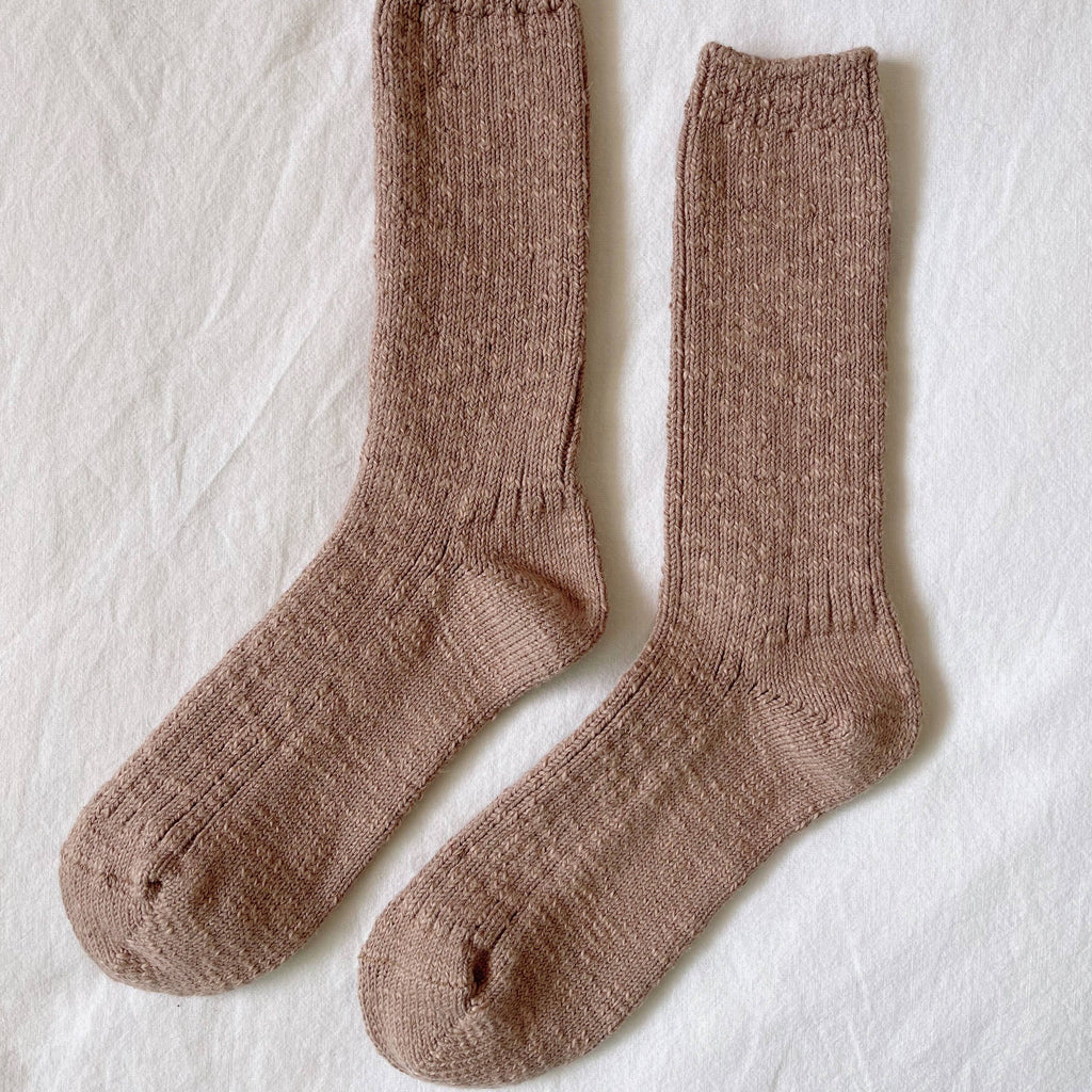 A long pair of soft brown Cottage Socks in Toffee.