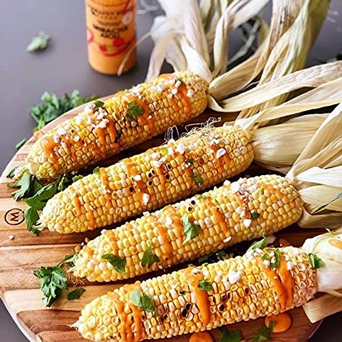 A row of corn drizzled with Sriracha Aioli Squeeze.